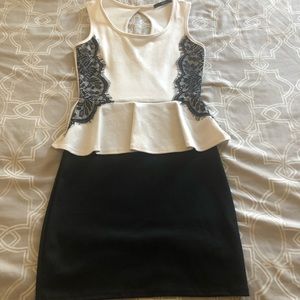 White and black peplum dress with lace detail